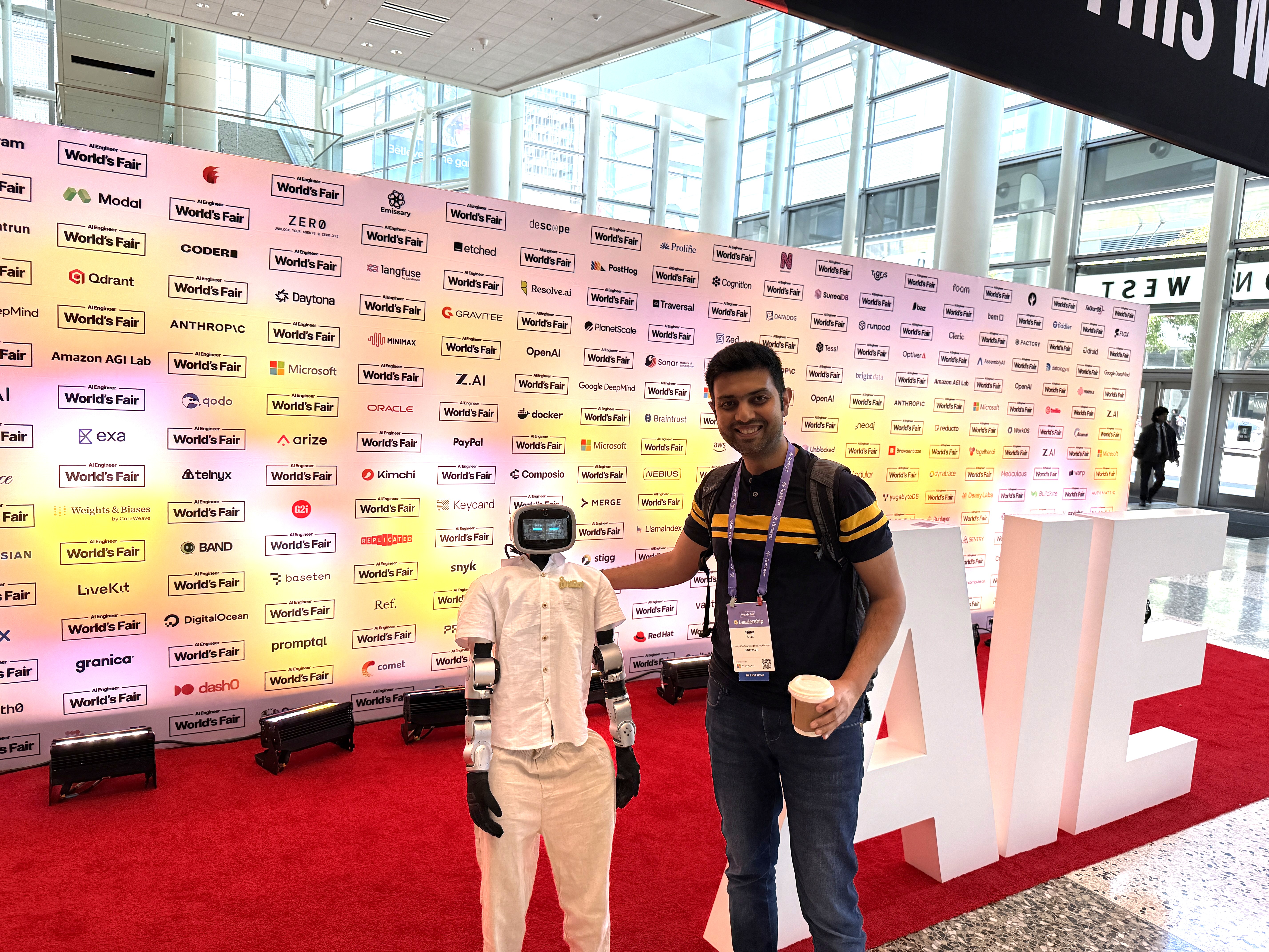 Nilay Shah with a robot at AI Engineer World’s Fair